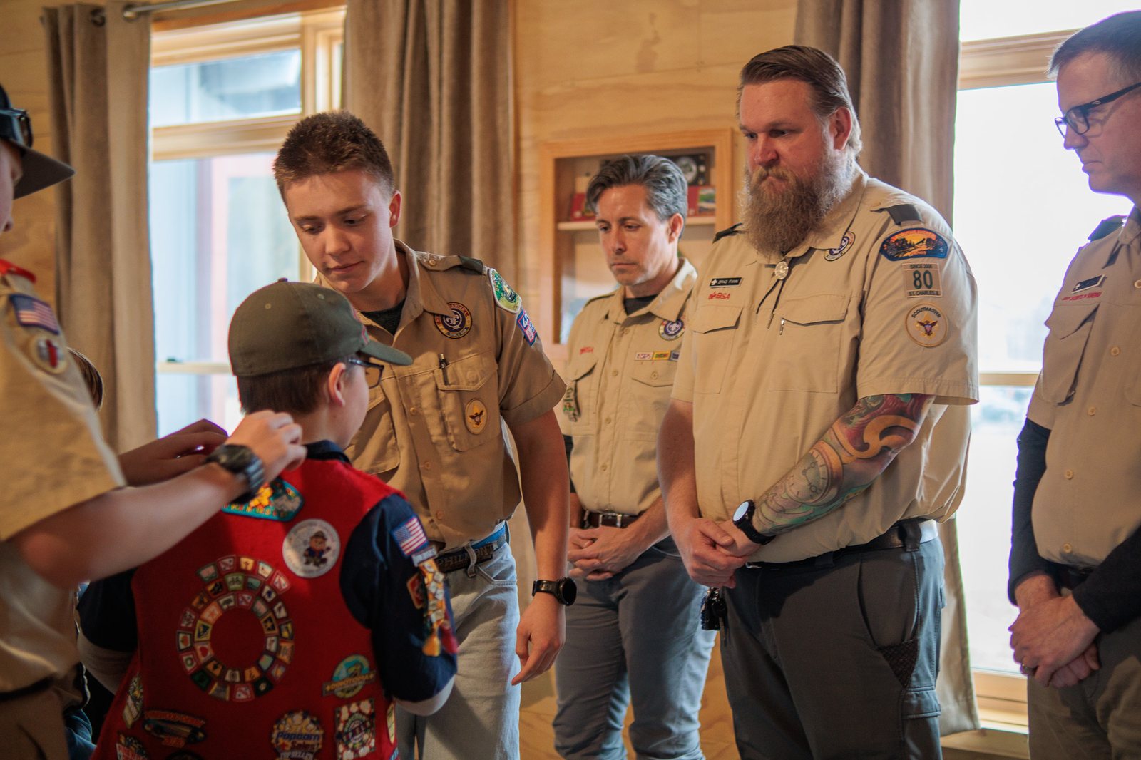 Scouts and leaders celebrating advancement at Blue and Gold