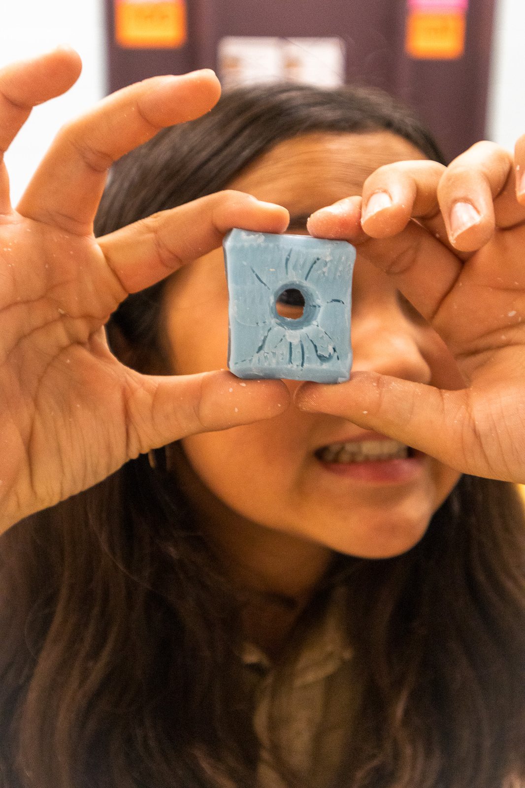 Scout proudly showing a handmade blue project
