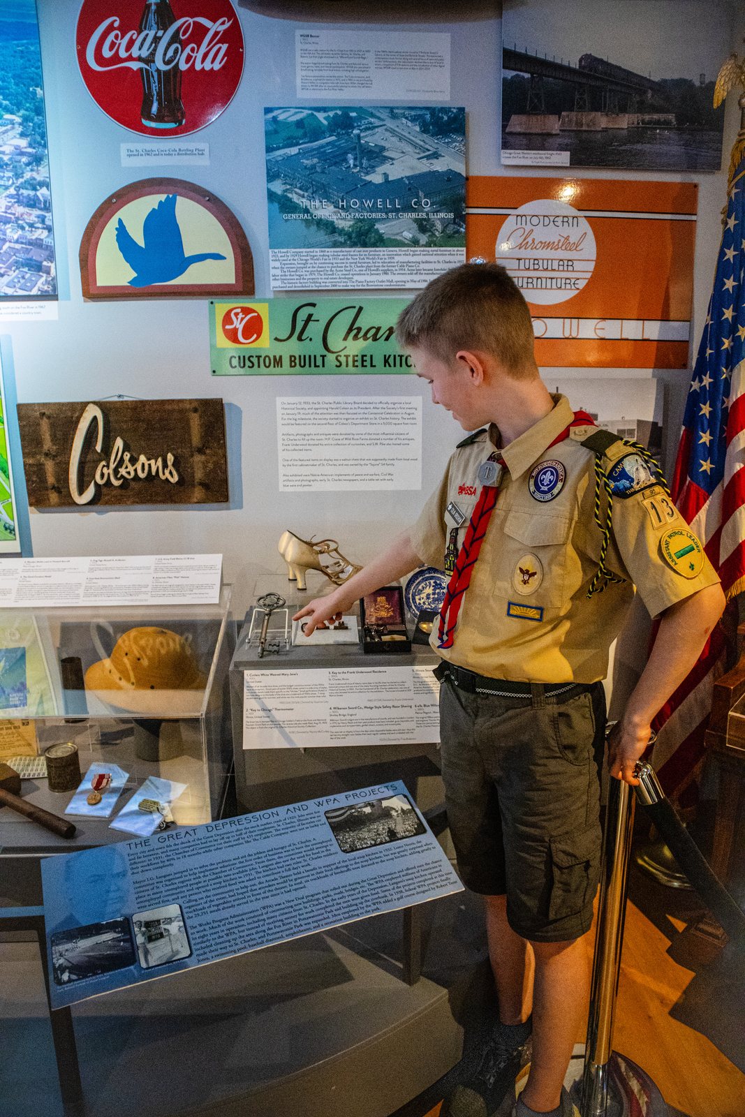 Scout examining a local history museum exhibit