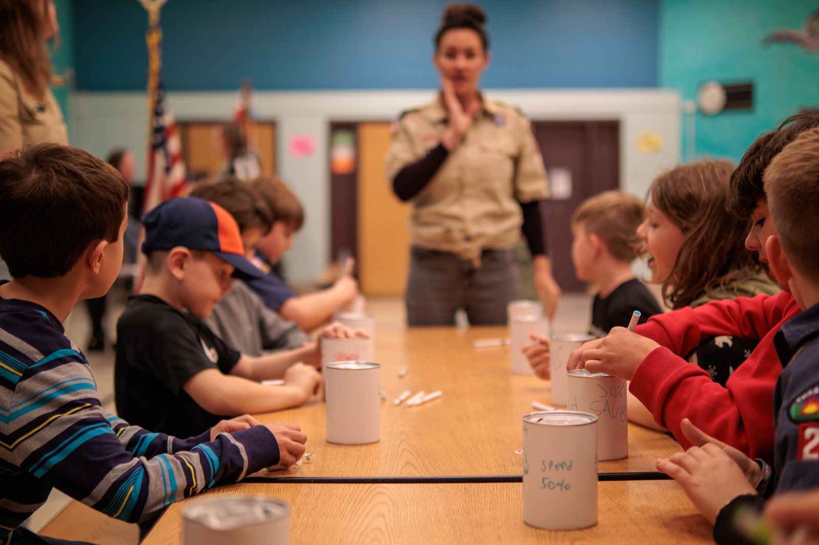 Scouts completing a practical activity at a pack meeting
