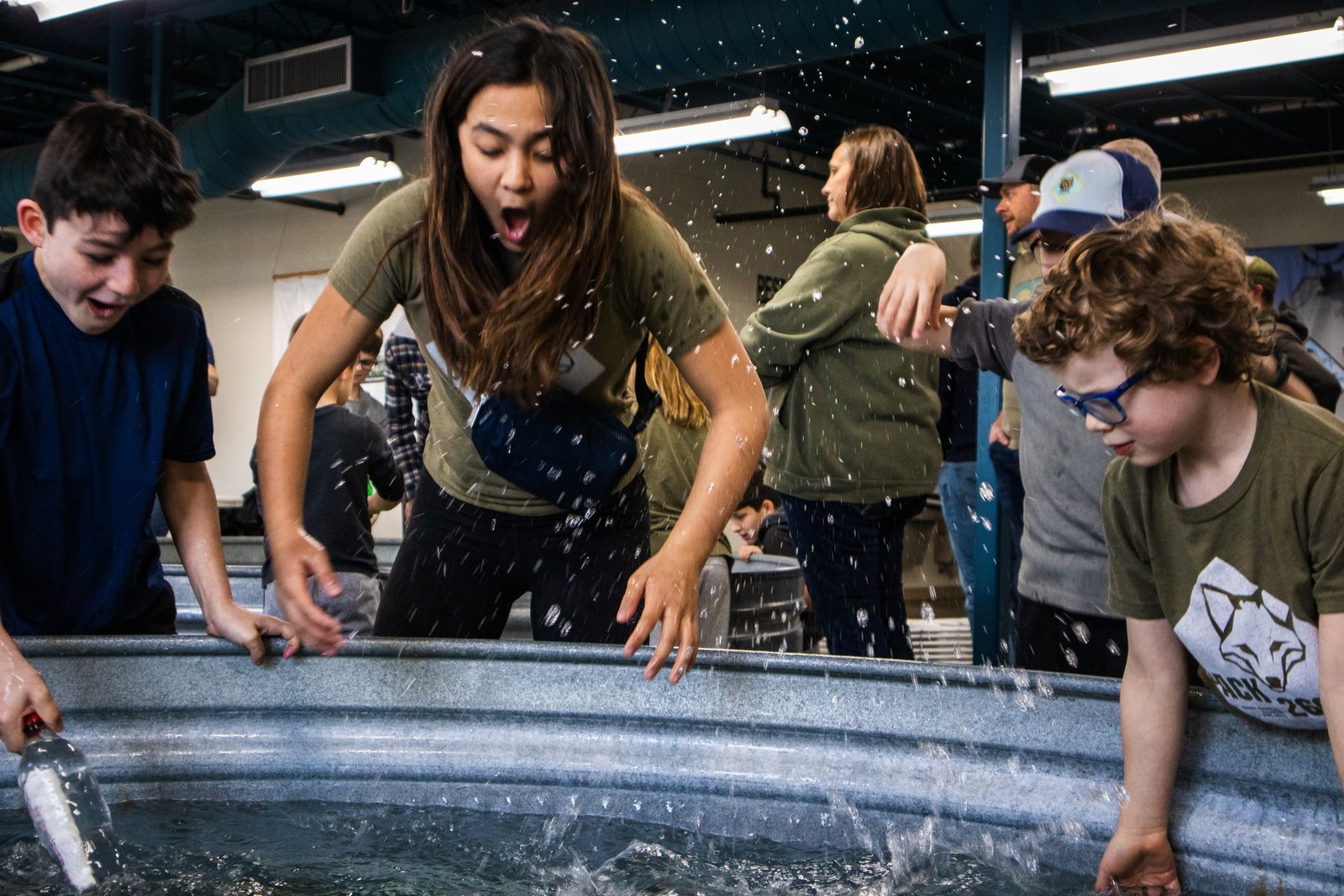 Scouts and parents enjoying an interactive water exhibit