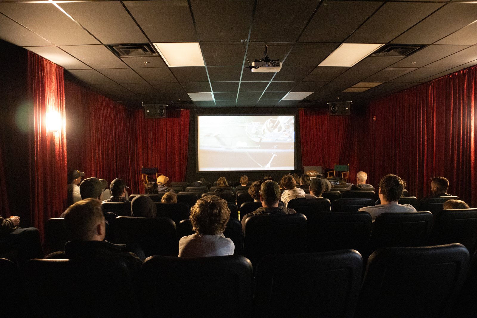 Pack families watching a presentation at the USS Silversides museum